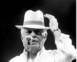 Dorival Caymmi, in his white shirt and straw hat